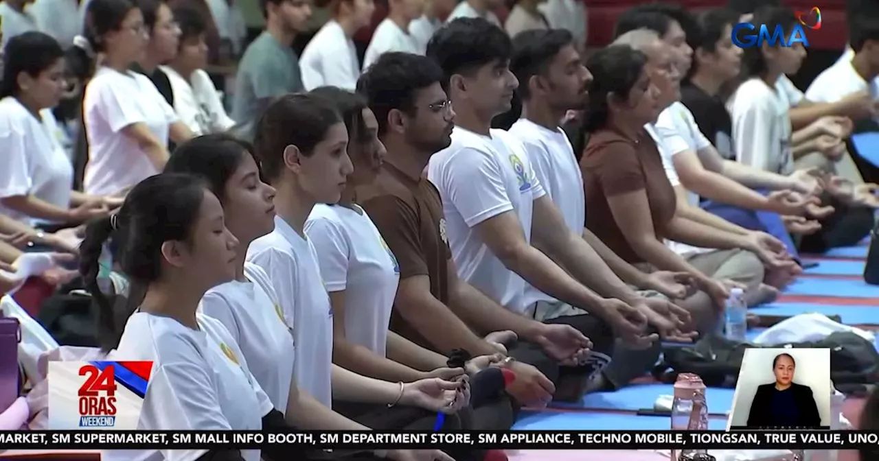 Over 300 Practice Yoga at University for International Yoga Day