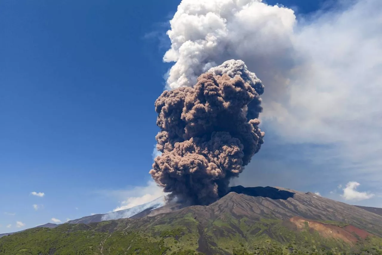 Sicily's Mount Etna erupts with columns of smoke and ash