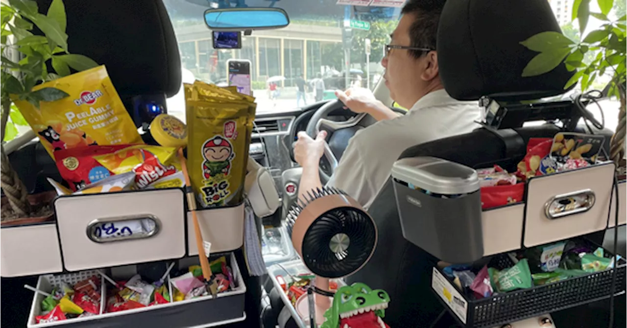 Passenger Touched By Assortment Of Snacks & Water Available In Kind Grab Driver's Car