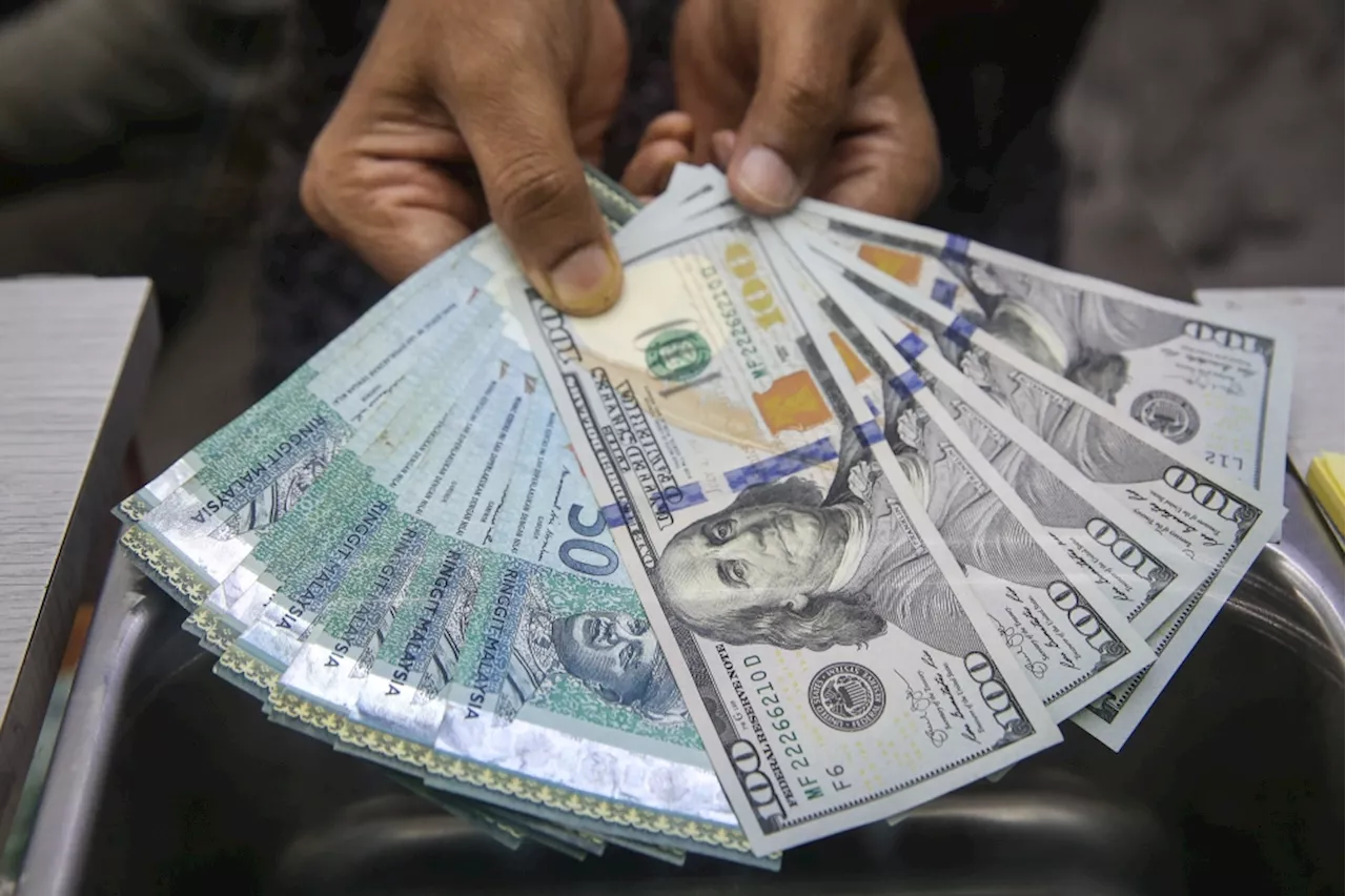 Ringgit opens lower against US dollar as global economic outlook weighs on Asian currencies
