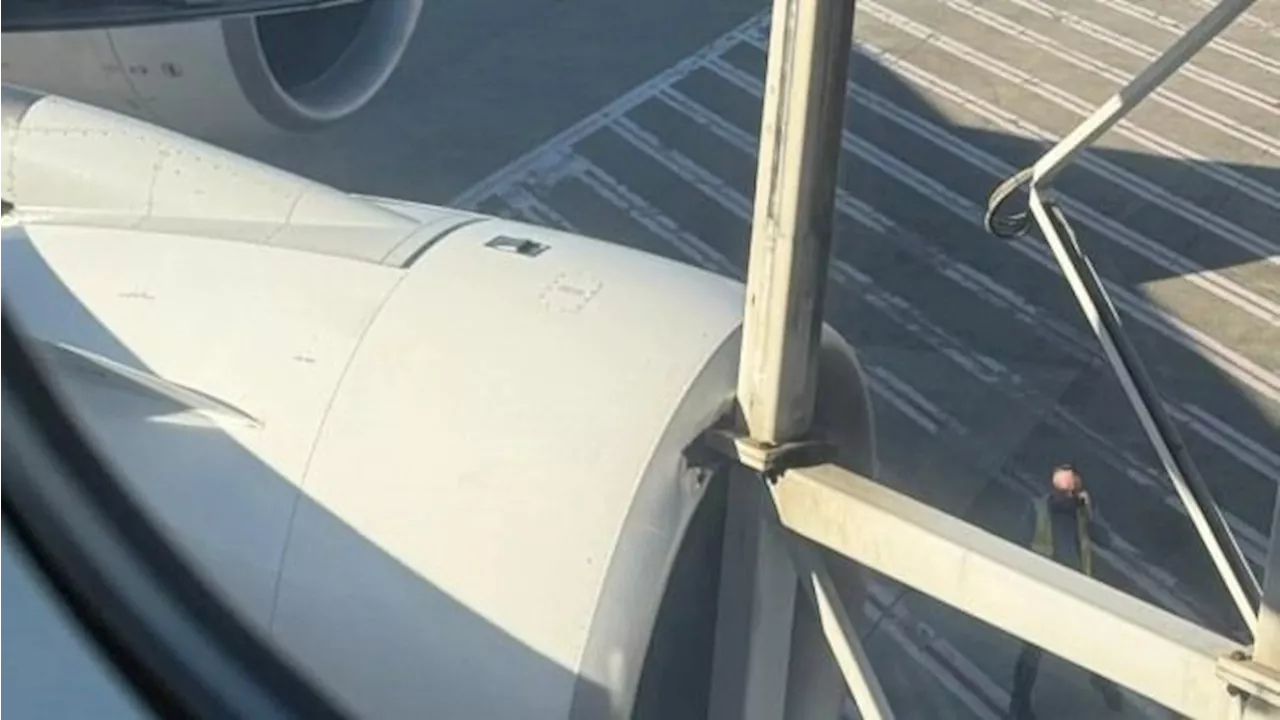 Qantas plane damaged in collision with aerobridge at Sydney Airport; flight delayed by almost a day