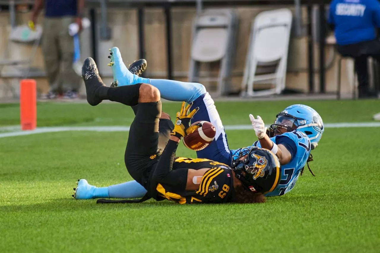 Veteran Bo Levi Mitchell throws five TD strikes to lead Ticats past Argos 51-38