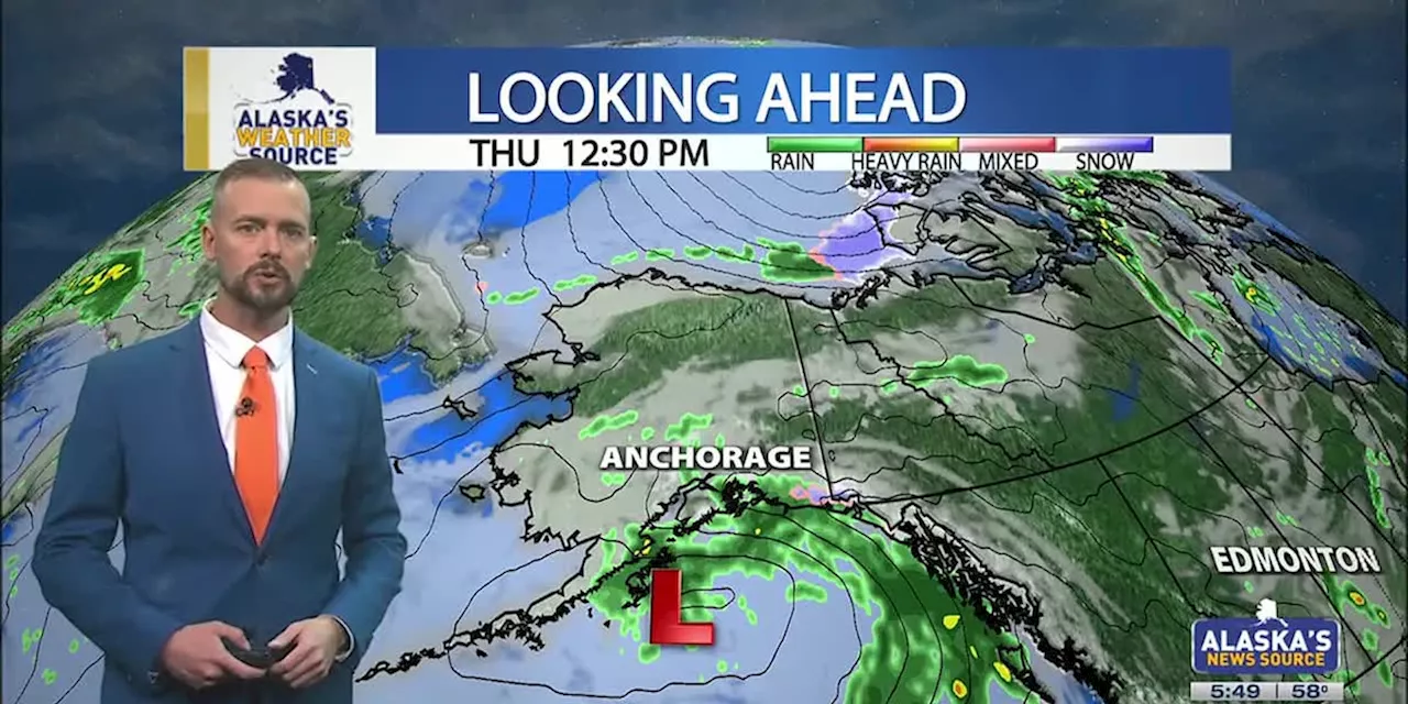 Cold front draped across the state driving in cooler air and heavy rain for Interior