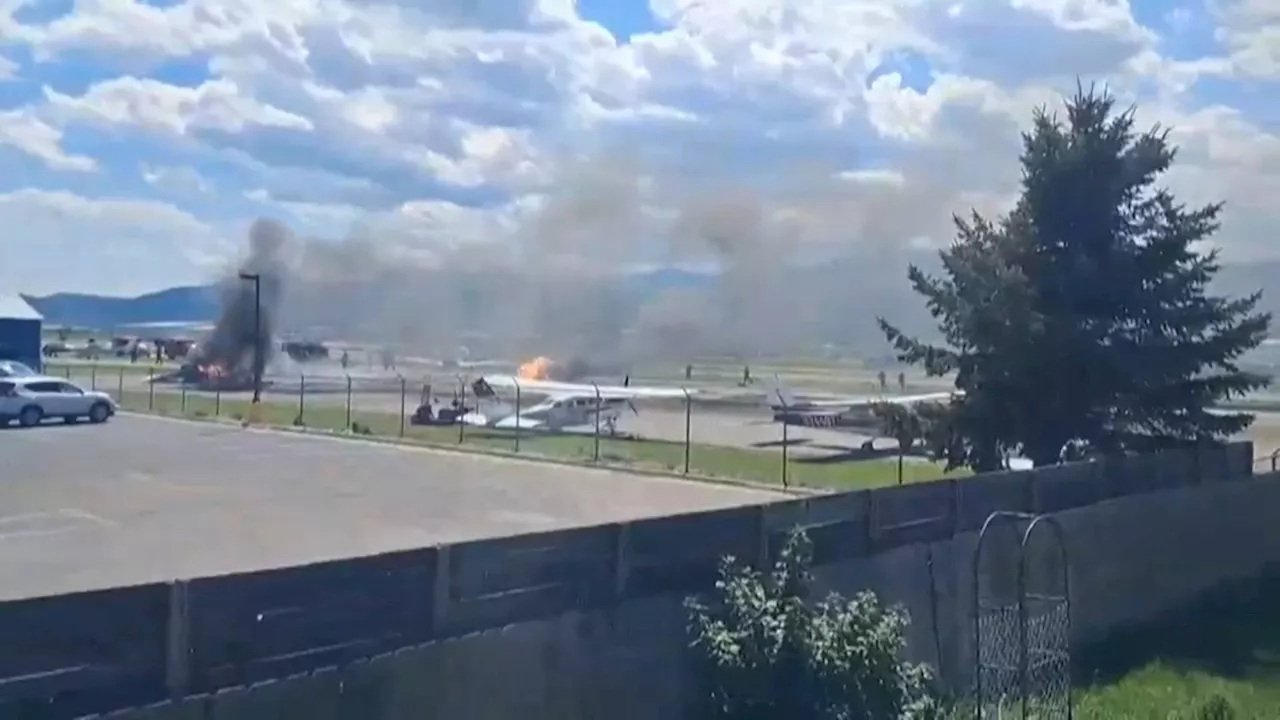 Plane crashes into parked aircraft while landing at Montana airport, sparking fire