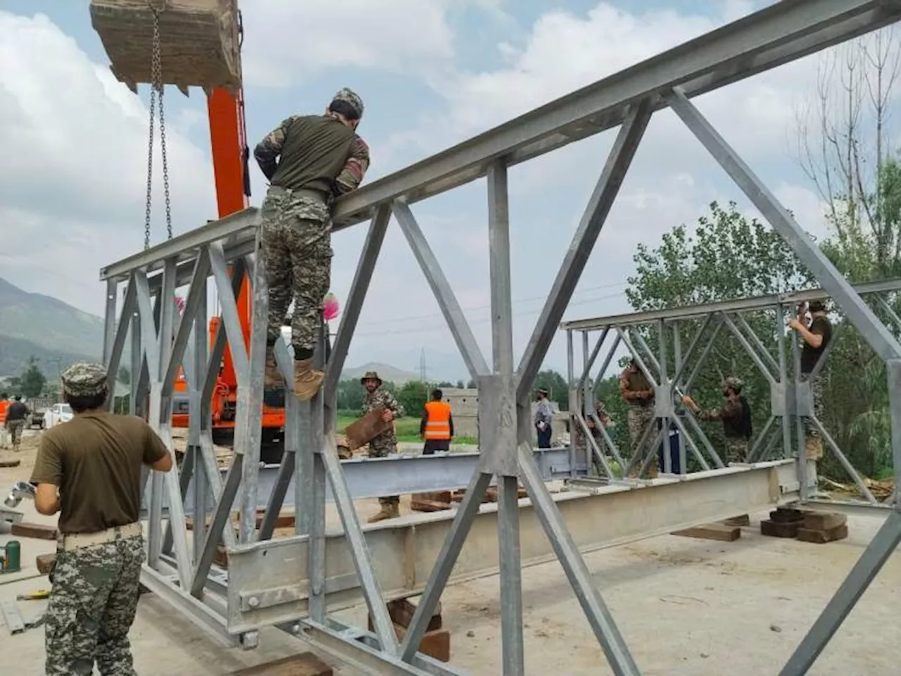 Pak Army engineers race to restore flood-damaged Jarr Bridge linking Bajaur and Dir