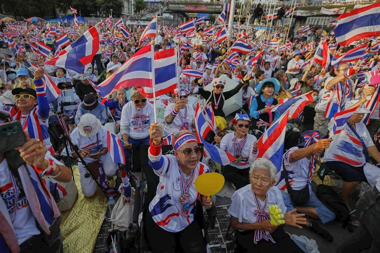Protesters in Bangkok demand resignation of court-suspended prime minister following deadly conflict