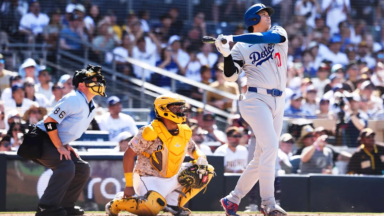 Shohei Ohtani high-fives a heckler after he homers in Dodgers' win over Padres