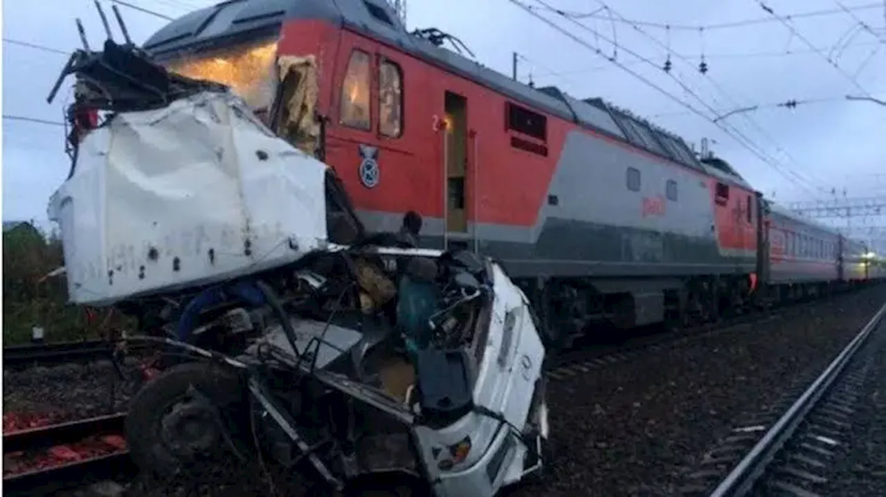 One dead, 11 injured after freight train collides with tourist bus