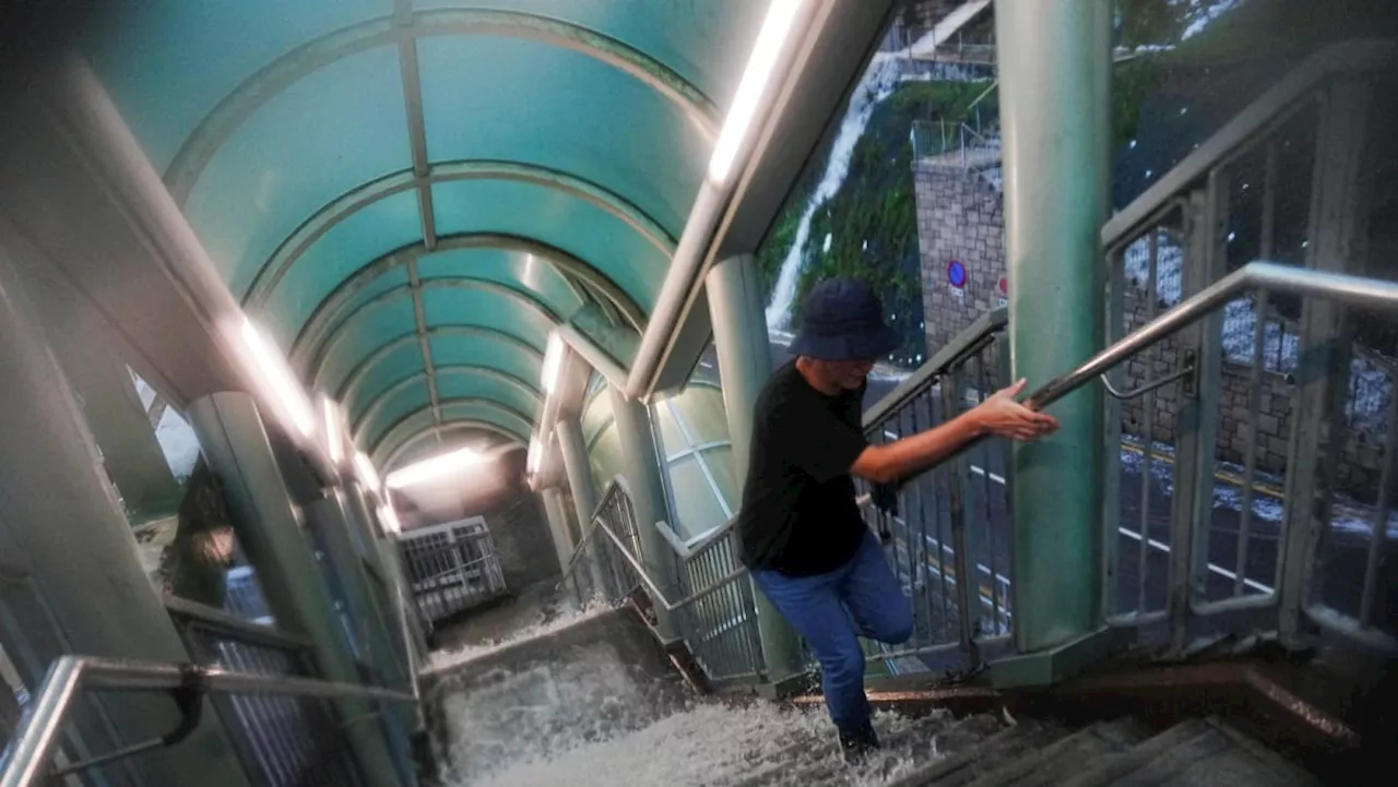 Hong Kong issues highest weather warning, as rains shut schools, courts and hospital wards
