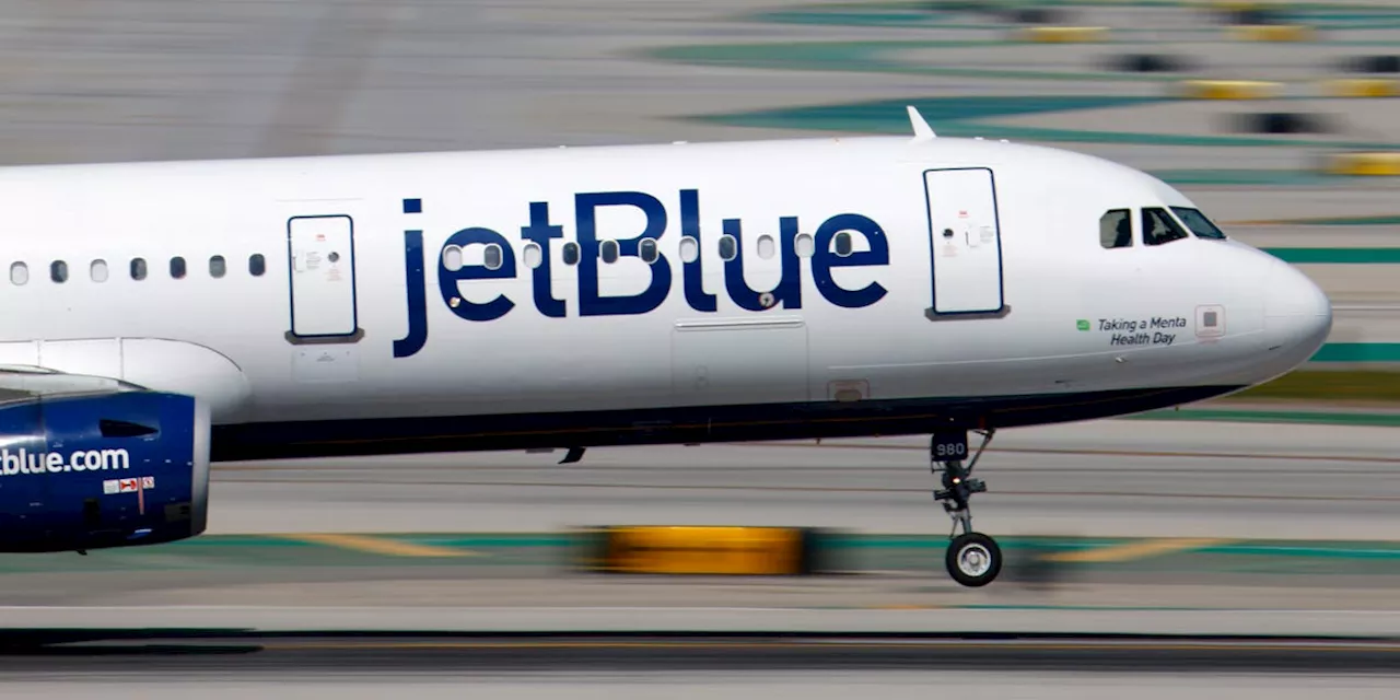 JetBlue hikes checked bag fees, citing rising operating costs